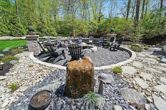 view of yard with an outdoor fire pit