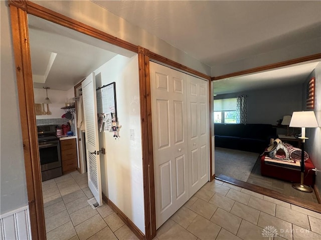 hallway with light tile patterned floors