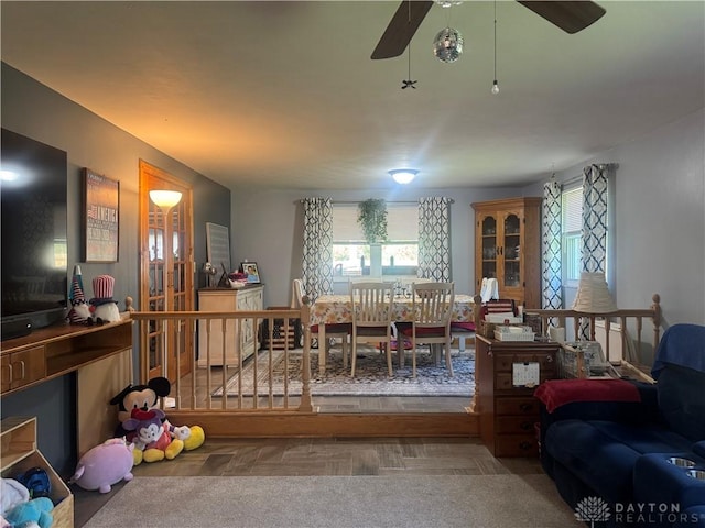 living room with a ceiling fan