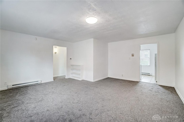 2334 Davue Cir, Dayton, OH 45406 - carpeted empty room with baseboards, a baseboard heating unit, and a baseboard radiator
