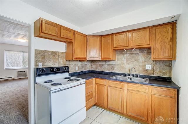 2334 Davue Cir, Dayton, OH 45406 - kitchen featuring brown cabinetry, a sink, electric range, and dark countertops