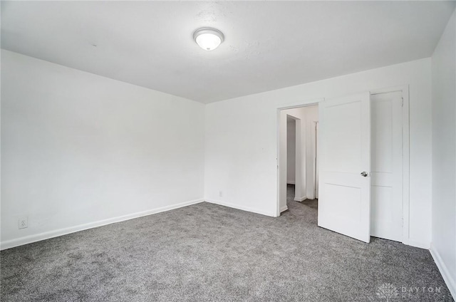 2334 Davue Cir, Dayton, OH 45406 - unfurnished bedroom with baseboards and carpet