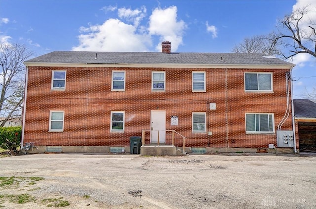 2334 Davue Cir, Dayton, OH 45406 - back of house featuring brick siding and a chimney