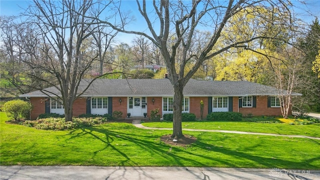 single story home with brick siding and a front lawn