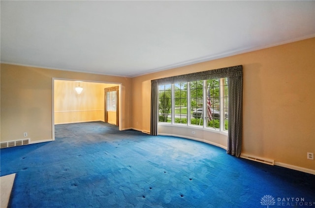 unfurnished room featuring baseboards, carpet flooring, and visible vents