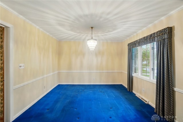 carpeted spare room featuring crown molding, baseboards, and visible vents