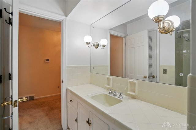 full bath featuring vanity, baseboards, and tasteful backsplash