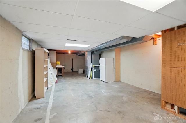 basement with freestanding refrigerator