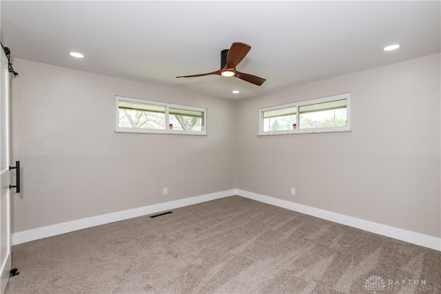 spare room featuring recessed lighting, a ceiling fan, carpet, and visible vents