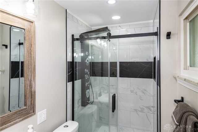 full bathroom with recessed lighting, a stall shower, and toilet