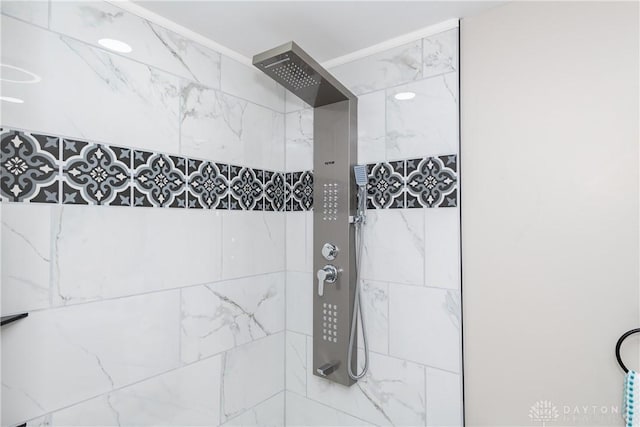 full bath with tiled shower