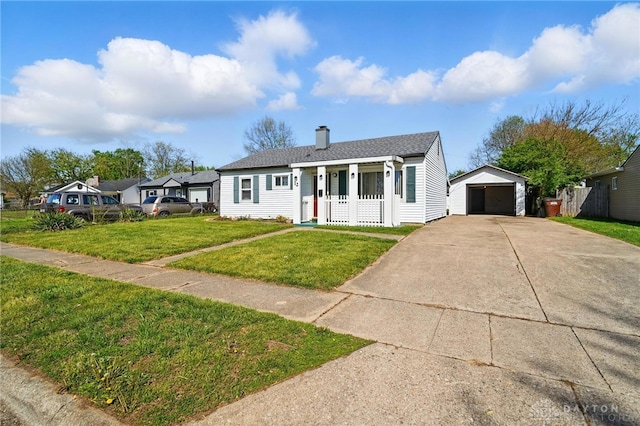 view of front of property featuring a garage, a front lawn, a chimney, a porch, and an outbuilding