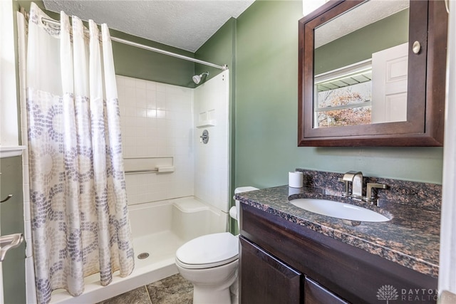 full bath with tile patterned flooring, vanity, toilet, a textured ceiling, and a shower stall
