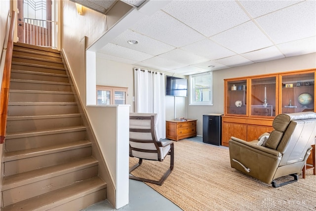 stairs featuring a paneled ceiling