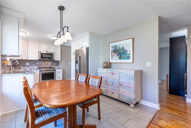 dining space with baseboards