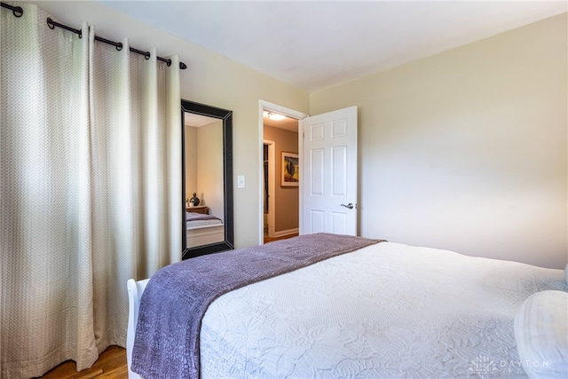 bedroom featuring wood finished floors
