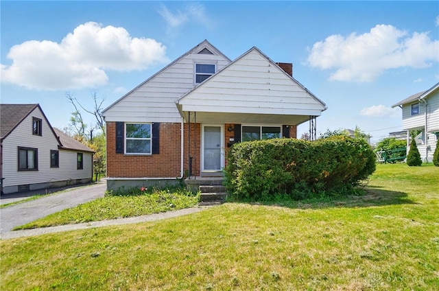 38 Homeview Dr, Harrison Twp, OH 45415 - bungalow with brick siding, a chimney, and a front lawn