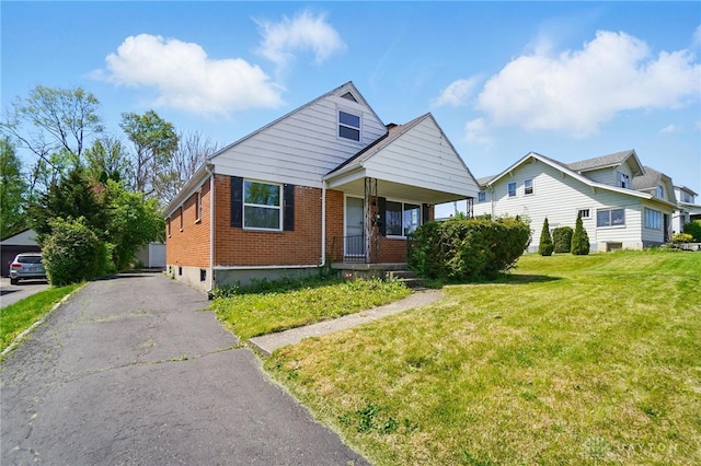 38 Homeview Dr, Harrison Twp, OH 45415 - bungalow-style home featuring brick siding, a front lawn, and covered porch