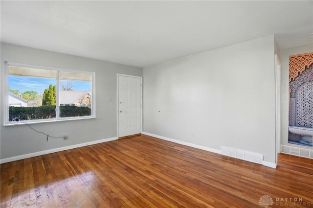 38 Homeview Dr, Harrison Twp, OH 45415 - unfurnished room featuring visible vents, baseboards, and wood finished floors