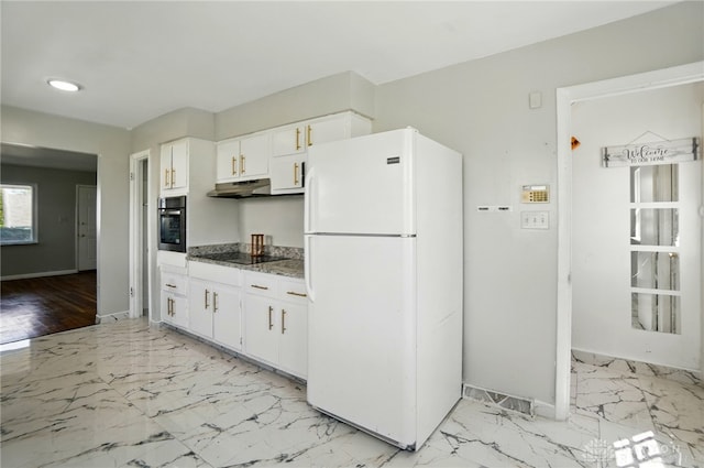 38 Homeview Dr, Harrison Twp, OH 45415 - kitchen with freestanding refrigerator, white cabinetry, wall oven, and baseboards