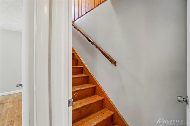 38 Homeview Dr, Harrison Twp, OH 45415 - stairway with baseboards and wood finished floors