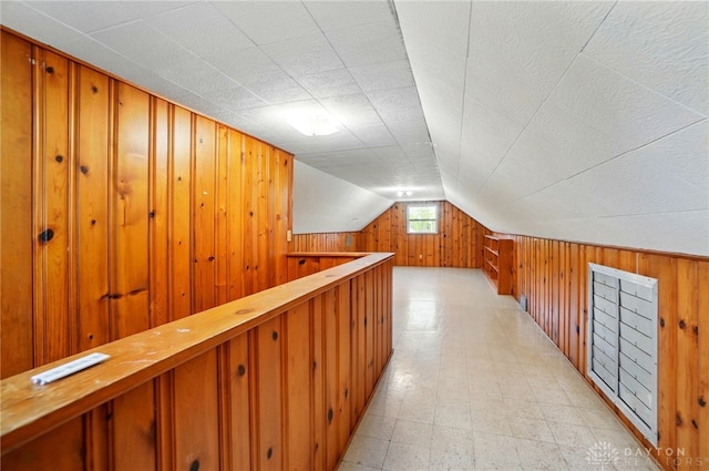 38 Homeview Dr, Harrison Twp, OH 45415 - bonus room with wooden walls, light floors, and lofted ceiling