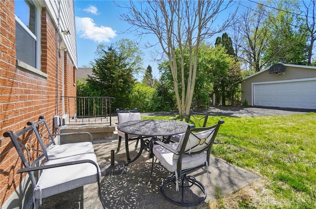 38 Homeview Dr, Harrison Twp, OH 45415 - view of patio / terrace with a garage and an outbuilding