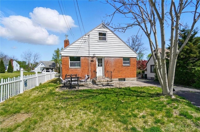 38 Homeview Dr, Harrison Twp, OH 45415 - rear view of house with a lawn, brick siding, fence, and a patio