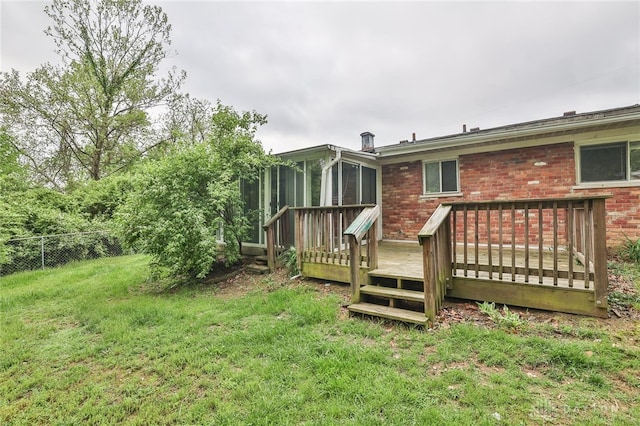 5565 Ehrling Rd, Cincinnati, OH 45227 - rear view of house with a sunroom, a deck, and brick siding