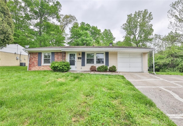 5565 Ehrling Rd, Cincinnati, OH 45227 - ranch-style home featuring a garage, concrete driveway, a front lawn, and central air condition unit