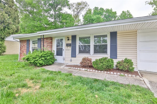 5565 Ehrling Rd, Cincinnati, OH 45227 - ranch-style house featuring a porch and an attached garage