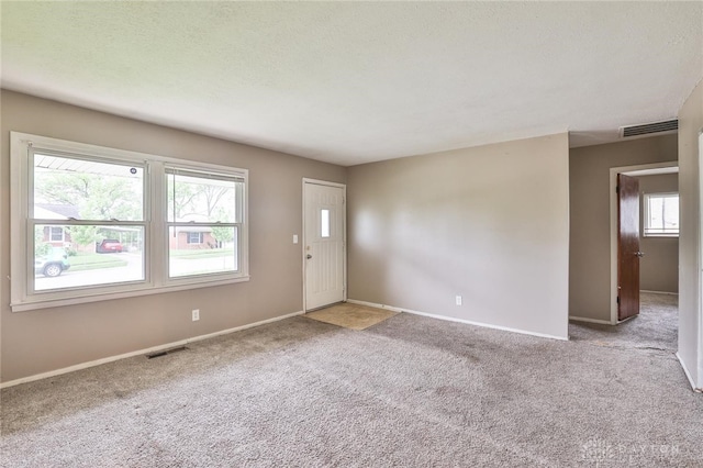 5565 Ehrling Rd, Cincinnati, OH 45227 - foyer entrance featuring carpet and baseboards