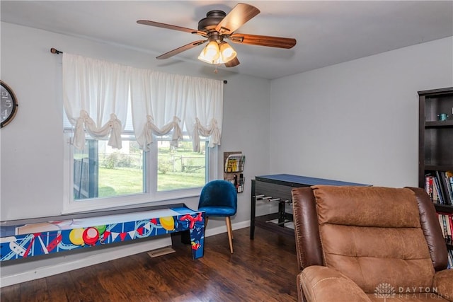 playroom featuring baseboards, a ceiling fan, and wood finished floors