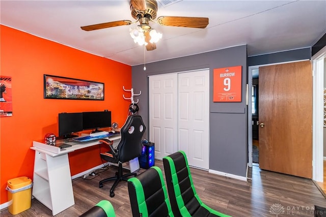 home office featuring baseboards, a ceiling fan, and wood finished floors