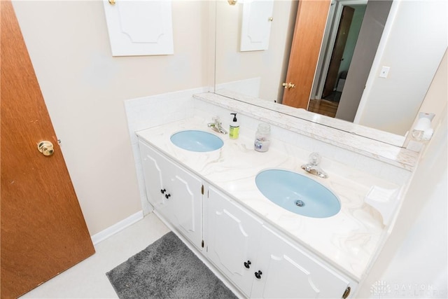 bathroom with double vanity and a sink