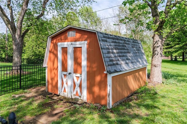 view of shed with fence