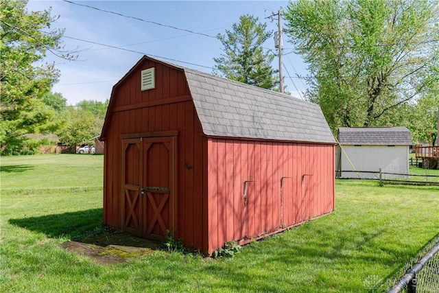 view of shed with fence