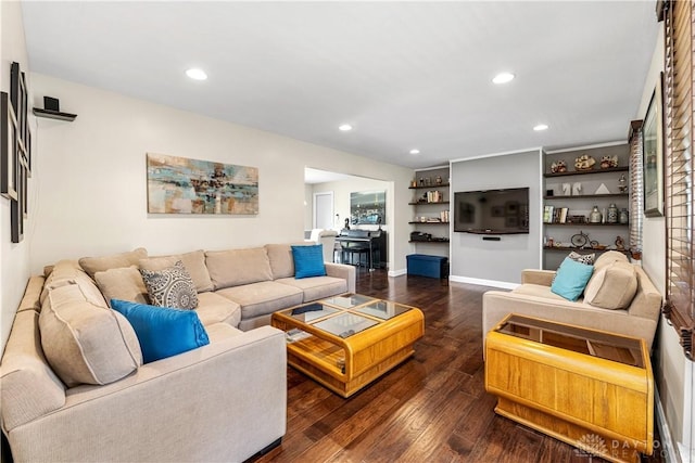 living area with recessed lighting and dark wood-style floors