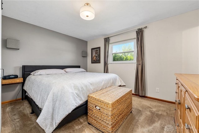 carpeted bedroom with baseboards