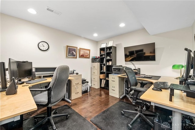 office space with recessed lighting, visible vents, and dark wood-type flooring