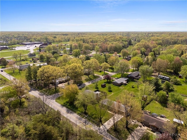 drone / aerial view featuring a forest view