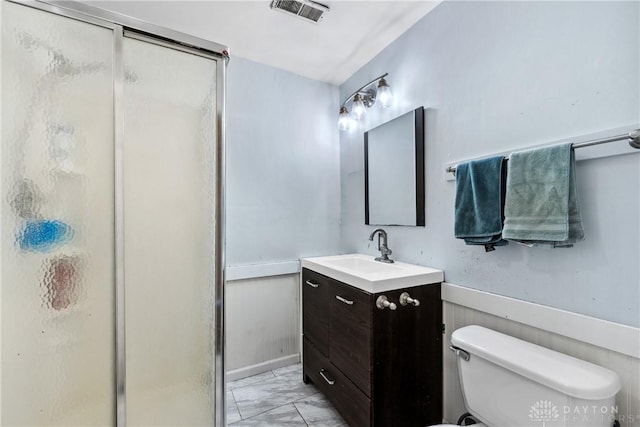 bathroom with visible vents, a shower stall, marble finish floor, and vanity