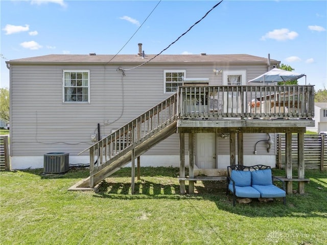 back of house with central AC, a yard, stairway, and a deck