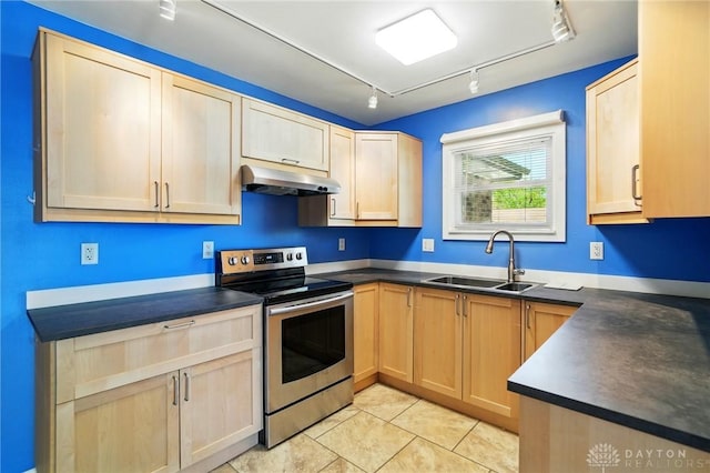 8398 Trowbridge Way, Huber Heights, OH 45424 - kitchen with track lighting, dark countertops, under cabinet range hood, a sink, and stainless steel range with electric cooktop