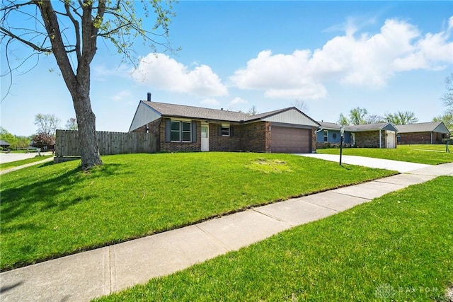 8398 Trowbridge Way, Huber Heights, OH 45424 - single story home with a garage, brick siding, fence, a front lawn, and concrete driveway