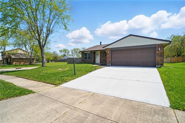 8398 Trowbridge Way, Huber Heights, OH 45424 - ranch-style home featuring driveway, brick siding, fence, a front lawn, and an attached garage