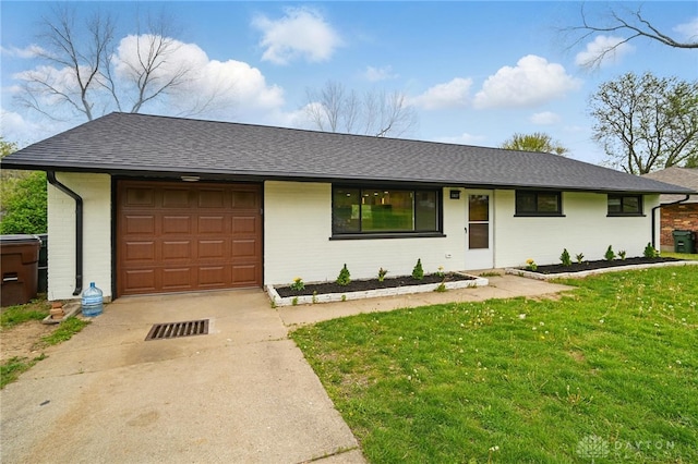 ranch-style home with a shingled roof, an attached garage, and brick siding