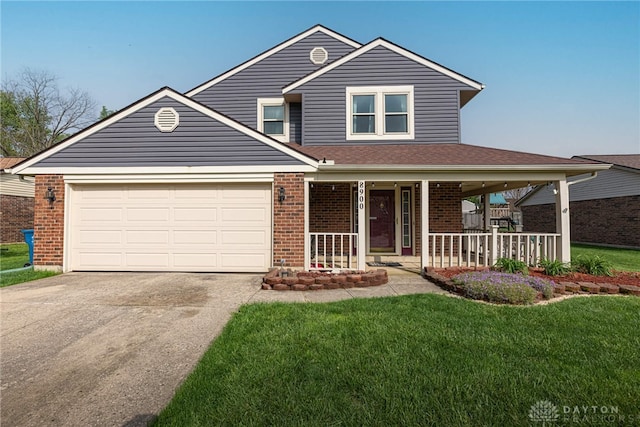 traditional-style home featuring covered porch, a front yard, driveway, and brick siding