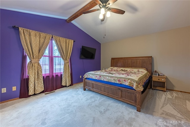 bedroom with ceiling fan, lofted ceiling with beams, baseboards, and carpet
