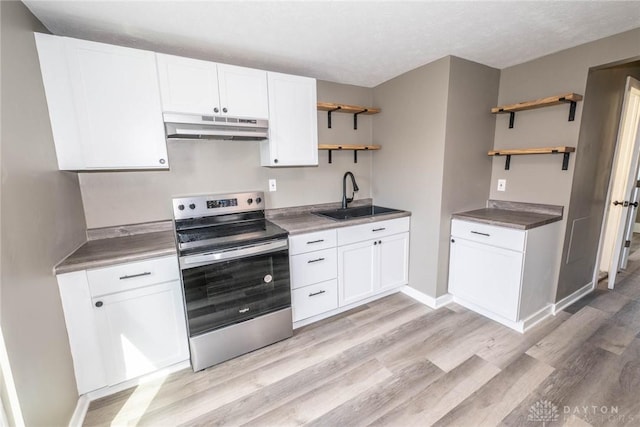 kitchen with open shelves, under cabinet range hood, stainless steel electric stove, a sink, and light wood finished floors